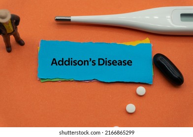 Addison's Disease.The word is written on a slip of colored paper. health terms, health care words, medical terminology. wellness Buzzwords. disease acronyms.