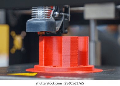 The additive manufacturing by 3D printer machine. The high technology manufacturing process by rapid prototype method. 