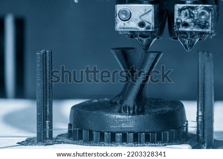 The additive manufacturing by 3D printer machine. The high technology manufacturing process by rapid prototype method. 