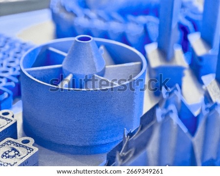 Additive manufacturing process showcasing various metal products created through advanced 3D printing techniques