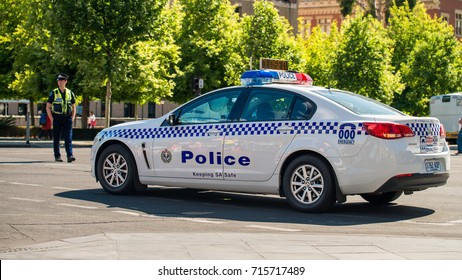 Adelaide, Australia - November 14, 2015: South Australian Police Car Closed The Street In  Adelaide's CBD On A Day With The Policeman Patrolling On The Background