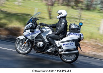 Adelaide, Australia - September 25, 2016: South Australian Police Officer Riding A BWM Police Motorcycle On Country Roads Near The Town Of Birdwood, South Australia.