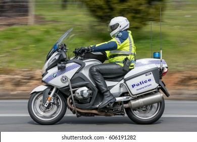 Adelaide, Australia - September 25, 2016: South Australian Police Officer Riding A BWM Police Motorcycle On Country Roads Near The Town Of Birdwood, South Australia.