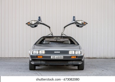 Adelaide, Australia - September 7, 2013: DeLorean DMC-12 car with opened doors parked on street near shed