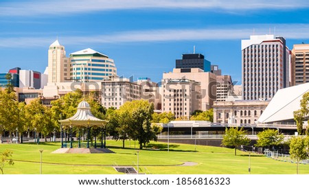 Adelaide city skyline with iconic rotunda viewed across Elder Park on a bright day