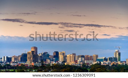 Adelaide night city skyline viewed from south-west towards north-east through parklands at dusk