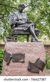 Adelaide SA, Australia - November 20, 2009: Closeup Of Dark Bronze Statue Of Sitting Dame Roma Mitchell, Governor, On Pedestal Set In Green Park. 