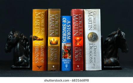 ADELAIDE, SOUTH AUSTRALIA - JULY 12, 2017: Popular Fantasy Hardcover Books, A Song Of Ice And Fire, By George R R Martin, Between Horse Head Bookends.