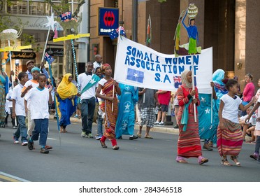 ADELAIDE,AUSTRALIA - JANUARY 25, 2014:People Of Somali Community  At Free Australia Day Parade Walking Along The King William Street With Flags And Transparencies