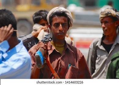 Aden, Yemen - September 14, 2006: Unidentified Young Yemeni Man Holds A Rifle At The Street In Aden, Yemen.