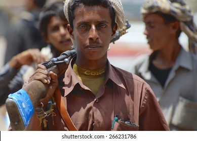 ADEN, YEMEN - SEPTEMBER 14, 2006: Unidentified Young Yemeni Man Holds A Rifle In Aden, Yemen.