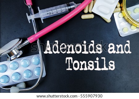Adenoids and tonsils word, medical term word with medical concepts in blackboard and medical equipment.