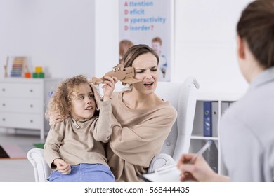 ADHD Child Annoying His Mother At Psychologist Office