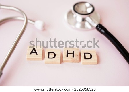 ADHD concept. Attention Deficit Hyperactivity Disorder. wooden block letters with stethoscope.