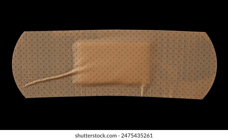 Adhesive band aid crumpled isolated on black background, top view