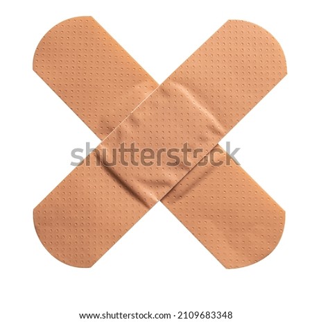 adhesive bandage cross isolated on white