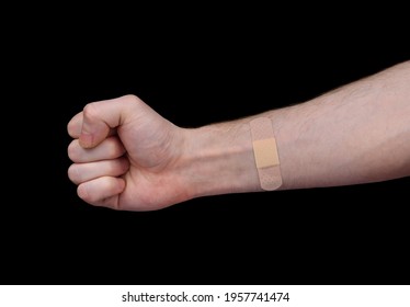 An Adhesive Plaster Is Glued To The Man's Forearm 