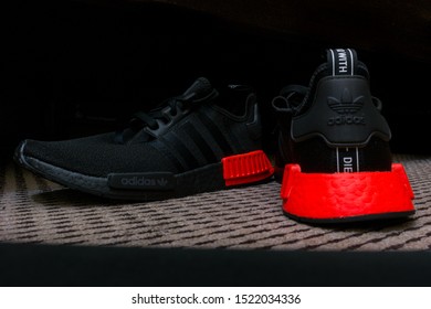 ADIDAS NMD sneakers with ULTRA BOOST technology in all black with red accent - sports shoes 
- Dubai, UAE - September 25, 2019