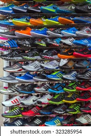 Adidas Shoes In Shoe Store Display And Of Nike Sport Shoes. New Unbranded Running Shoe, Sneaker Or Trainer.