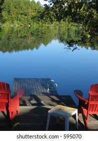 Adirondack Chairs Facing The Lake