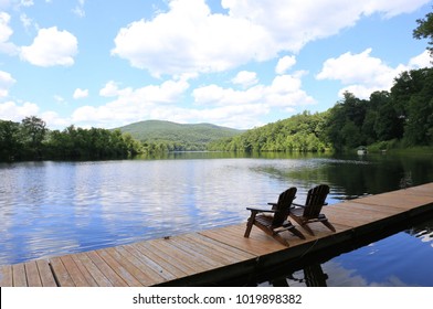 Adirondack Chairs On The River Dock