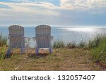 Adirondack chairs on the shore of Lake Michigan at Blue Harbor Resort in Sheboygan, WI.