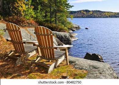 Adirondack chairs at shore of  Lake of Two Rivers, Ontario, Canada