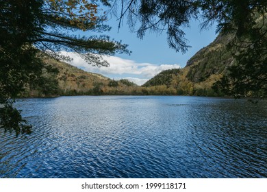 Adirondacks, NY, USA - June 29 2021: Mountains With Spring Water And Blue Sky Scene. Green Untouched Forest Landscape. Summertime In Adirondack Mountains. Upstate New York.