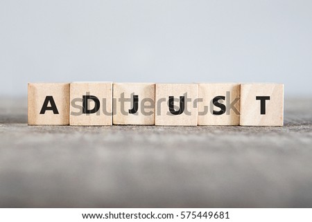 ADJUST word made with building blocks