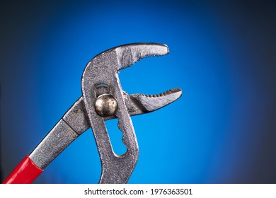 Adjustable Pliers On Blue Background
