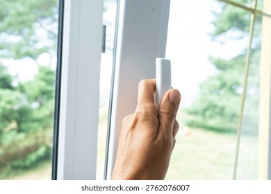 Adjustable PVC window opening for optimal ventilation, energy-saving double glazing, stylish hardware, professional window installation and mounting.
