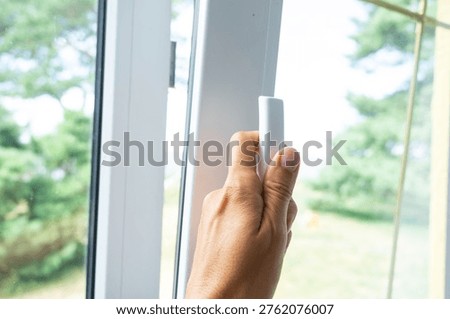 Adjustable PVC window opening for optimal ventilation, energy-saving double glazing, stylish hardware, professional window installation and mounting.
