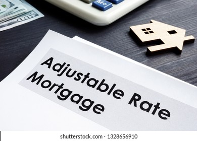 Adjustable Rate Mortgage ARM Documents On A Table.