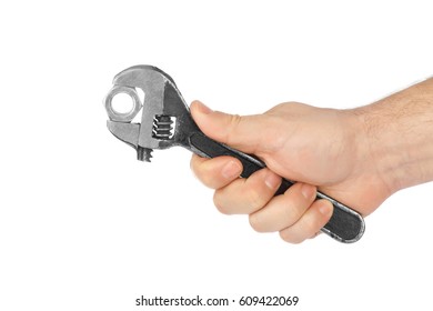 Adjustable spanner in hand isolated on white background