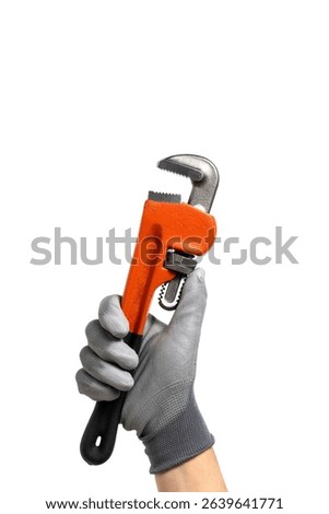 Adjustable spanner in hand isolated on white background