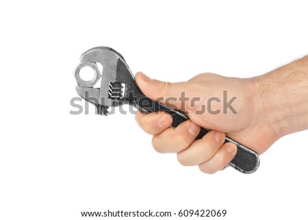 Adjustable spanner in hand isolated on white background