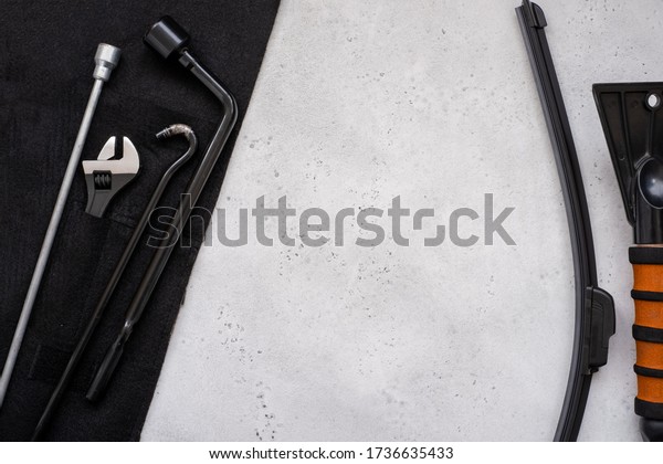 Adjustable and spanner, hexagon\
and wiper blade auto equipment. The wrench steel tools for repair\
and hexagon tool or allen wrench set on light gray\
background.