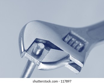 Adjustable Spanner Holding A Roofing Blt. (Duotone)