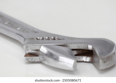 Adjustable spanner on a white background. Close-up.