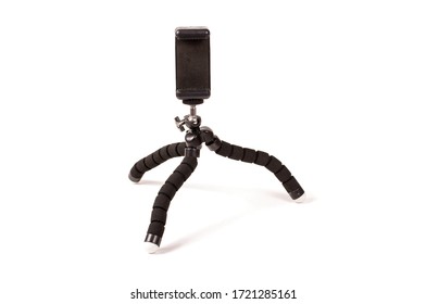 Adjustable universal smart phone tripod for remote recording and podcast isolated on the white background
