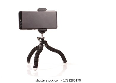 Adjustable universal smart phone tripod for remote recording and podcast isolated on the white background