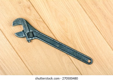 adjustable wrench embossed on the wooden floor