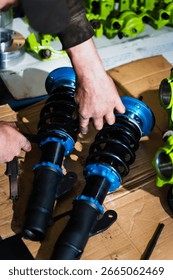 Adjusting coilover height and preload with micrometer precision ensures optimal balance and weight distribution on purpose-built drift car. Measuring Coilover before installing on drift car project