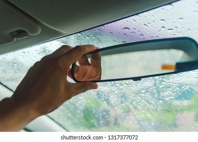 Adjusting the rearview mirror in the car to make the rear view better on heavy rain days, Rearview mirror adjustment in cars, Washing the car.