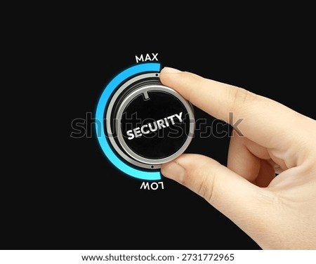 Adjusting security dial to maximum for better protection on black background with blue accents