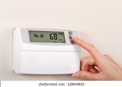 Adjusting And Setting Thermostat To Save Energy