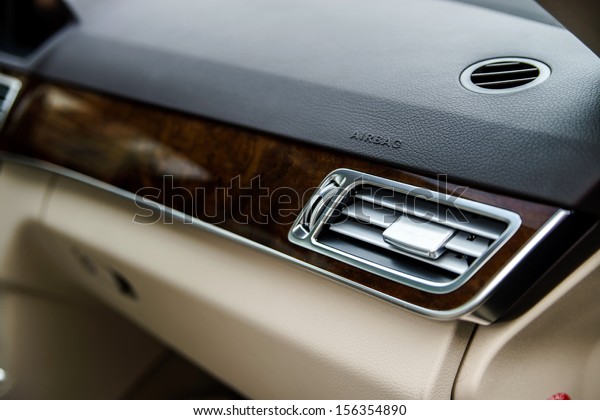 Adjustment handle for air flow direction  in\
town car. Ivory luxury\
interior