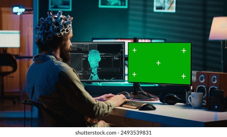IT admin coding and using EEG headset to upload brain into mockup computer, gaining immortality. Neuroscientist engineering transhumanism experiment on isolated screen PC, camera A