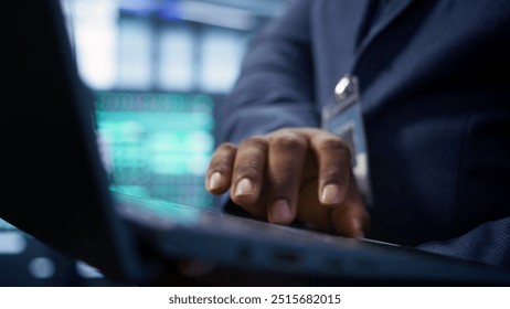Admin in data center runs system diagnostic tests and error checking utilities on laptop to fix problems. Close up shot of worker looking for network issues affecting rigs performance, camera B