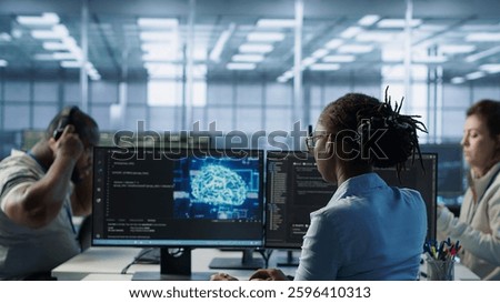Admin in data center using artificial intelligence computing simulating human brain thought processes in computerized model. Employee working with AI machine learning algorithms, camera A